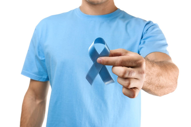 Young man holding blue ribbon - Φωτογραφία, εικόνα