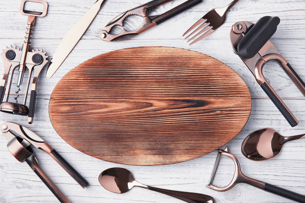 Composition with various kitchen utensils on wooden background - Valokuva, kuva