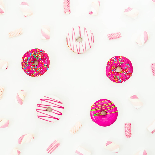 Frame of colorful pink donuts and marshmallows - Foto, Imagen