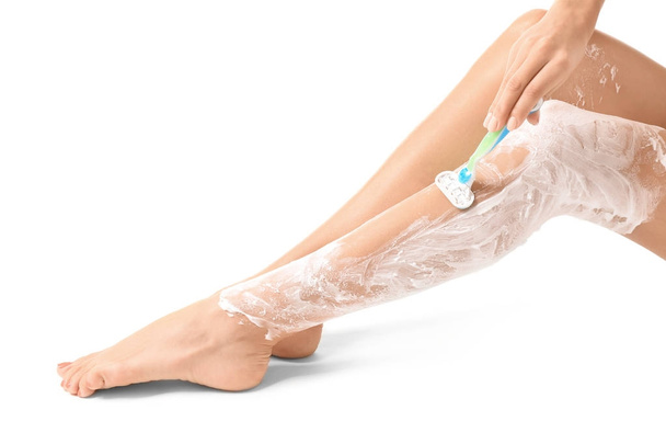 woman shaving her legs  - 写真・画像
