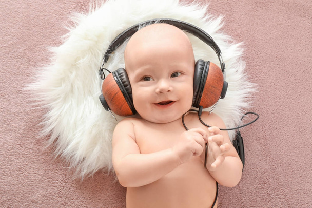 Cute baby listening to music - Foto, imagen