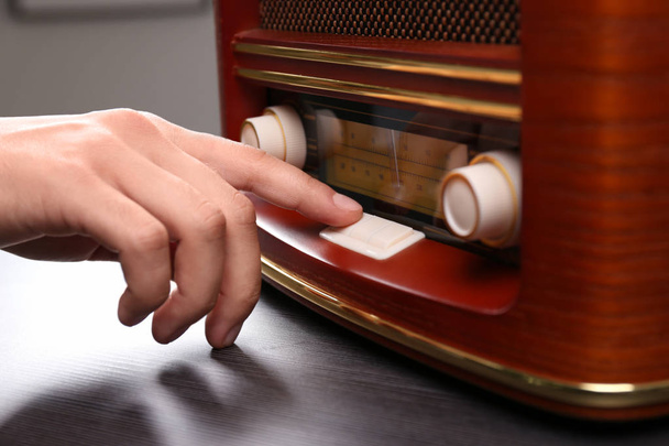 Person tuning retro radio, closeup - Фото, зображення