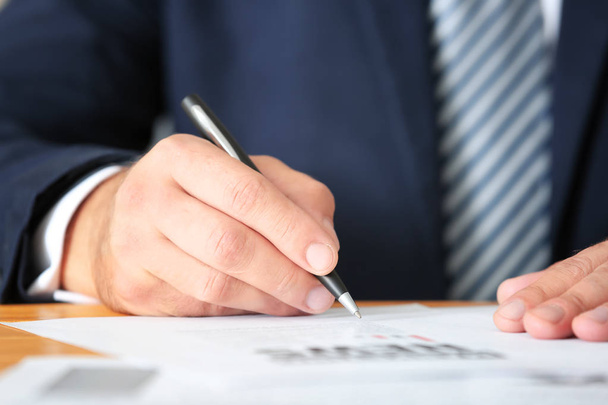 Businessman signing documents - Фото, изображение