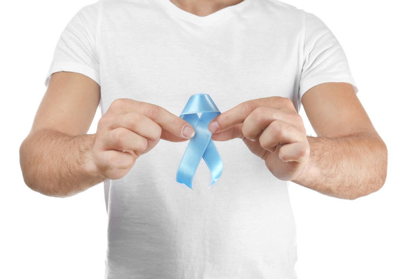 Young man holding blue ribbon  - Photo, image