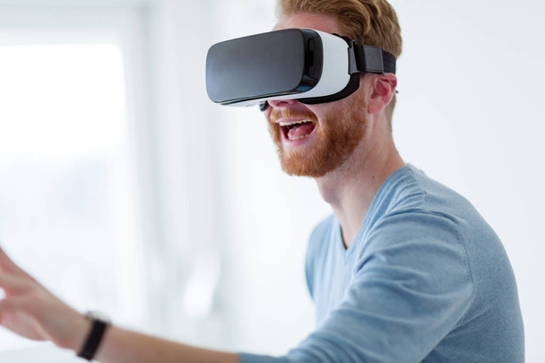 Man wearing virtual reality headset - Фото, изображение
