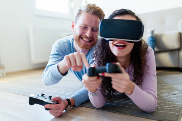 young couple playing video games - Photo, image