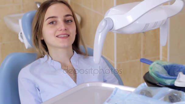 Patient in the dentists office spits into the basket - Felvétel, videó