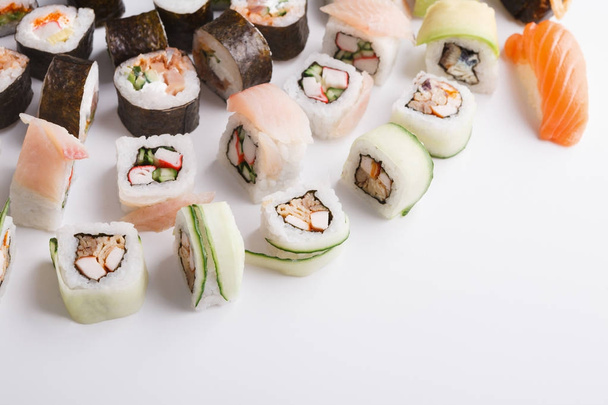 Set of sushi, maki and rolls on white background - Photo, image