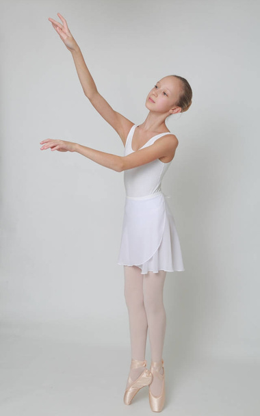 Beautiful little ballerina in studio - Photo, Image