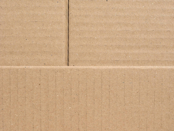 beige corrugated cardboard surface useful as a background - Photo, Image