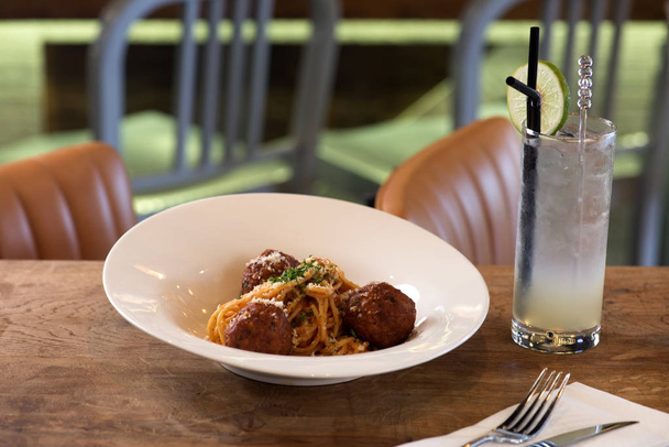 meatball pasta in a restaurant on wooden table - Foto, imagen