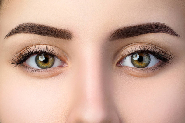 Close up view of beautiful brown female eyes - Fotografie, Obrázek