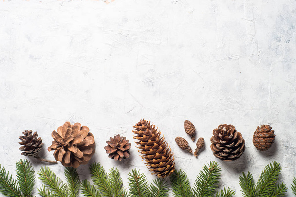 Christmas background with pine cones.  - Фото, изображение