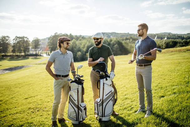 friends spending time on golf course - Photo, Image