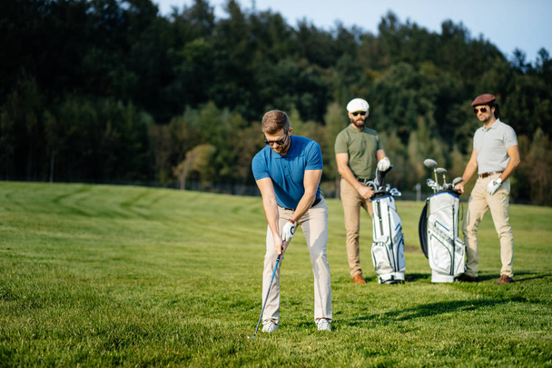 friends spending time on golf course - 写真・画像