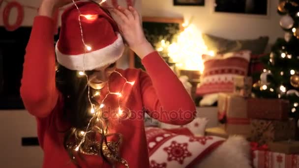 Woman has trouble with christmas lights - Footage, Video