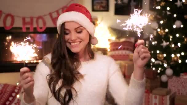 Cheerful woman with sparkler dancing  - Video