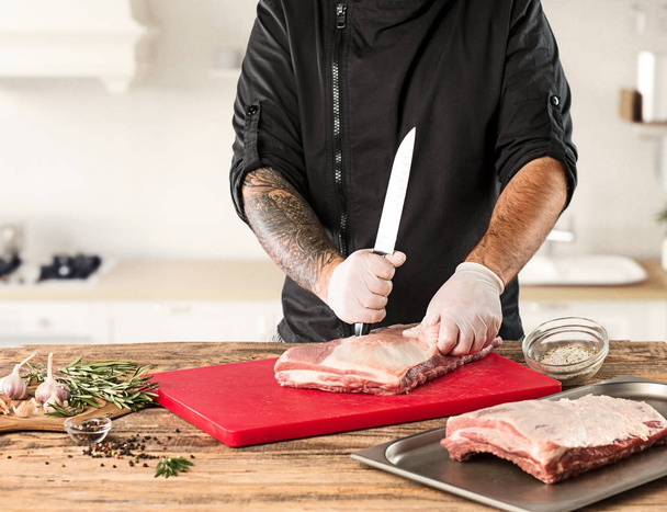 Man cooking meat steak on kitchen - Foto, immagini