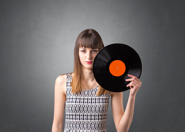 Women holding vinyl record - 写真・画像
