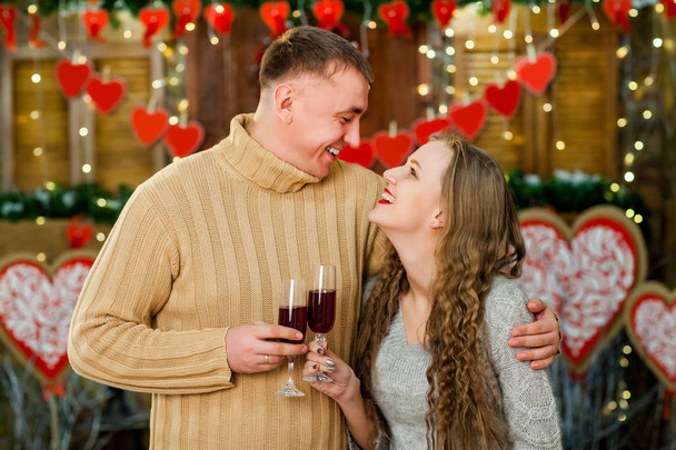 Boyfriend and girlfriend drinking wine on valentines day - Φωτογραφία, εικόνα