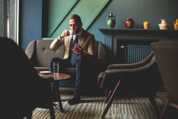 Middle-aged businessman drinking coffee  - Foto, Imagem