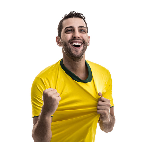 Brazilian fan celebrating on white background - Fotó, kép