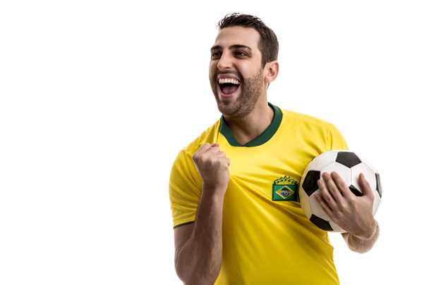 Brazilian fan celebrating on white background - Φωτογραφία, εικόνα