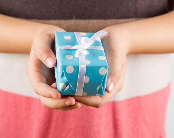 Give a present,gift box in hands girls - Фото, изображение
