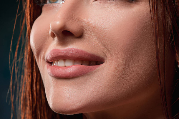Beautiful woman face portrait close up on dark - Fotografie, Obrázek