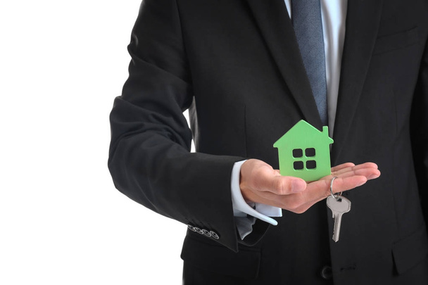 Real estate agent with house model - Foto, Imagem