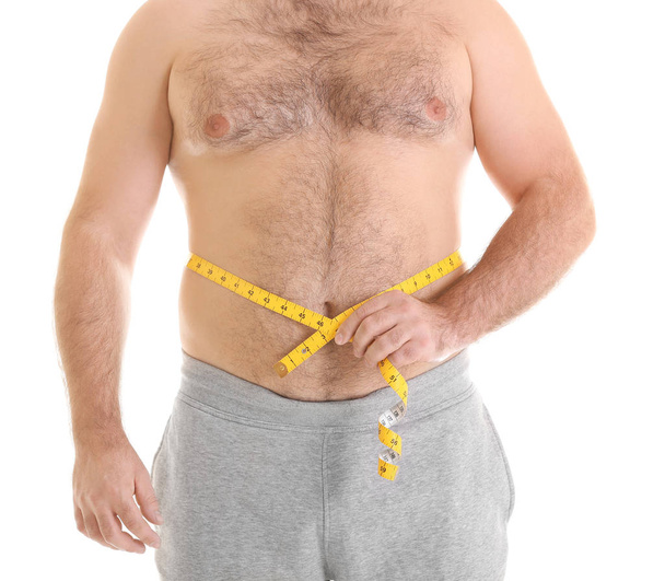 Overweight man with measuring tape  - Foto, imagen