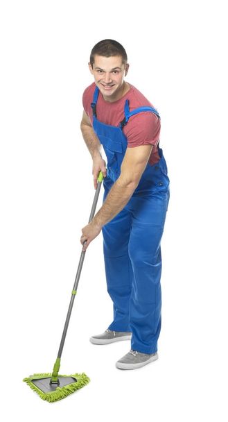 Young man with mop  - Фото, изображение