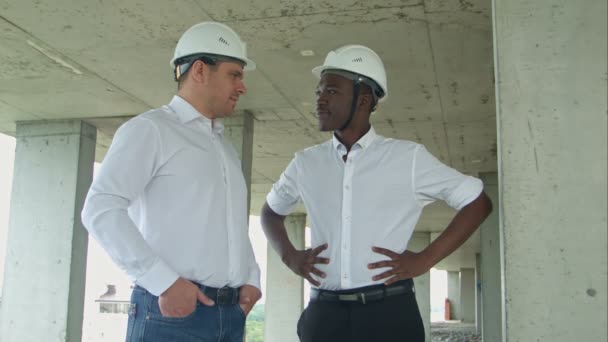 Architectural team smiling at the camera with hard hats - Footage, Video