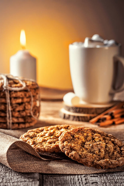 Winter autumn still life  homemade recipe honey ginger oatmeal cookie and bagel, cocoa cup coffee with marshmallow on wooden table kitchen - Φωτογραφία, εικόνα