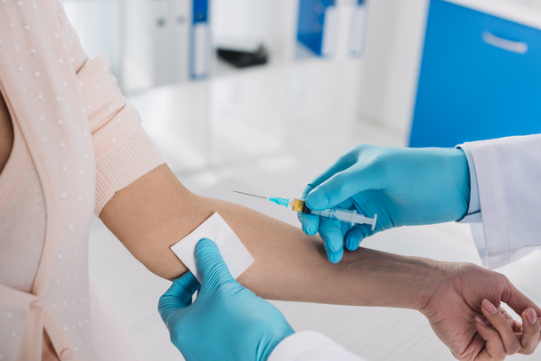 cropped image of doctor taking patient blood for test - Photo, Image