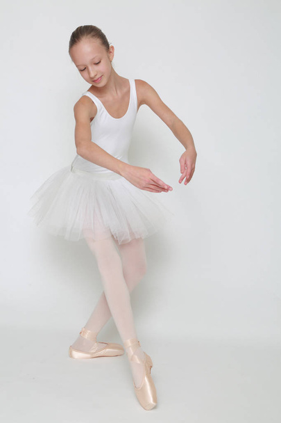 Beautiful little ballerina in studio - Photo, image