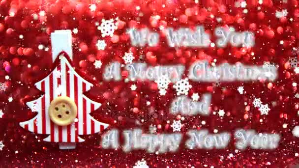le deseamos una feliz Navidad y un feliz texto de año nuevo, decorativo árbol de Navidad rojo y blanco y el efecto de la caída de la nieve
 - Metraje, vídeo
