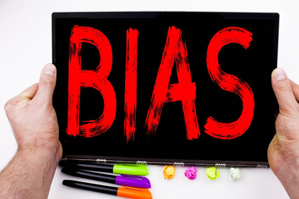 Bias text written on tablet, computer in the office with marker, pen, stationery. Business concept for Prejudice Biased Unfair Treatment white background with copy space - Photo, Image