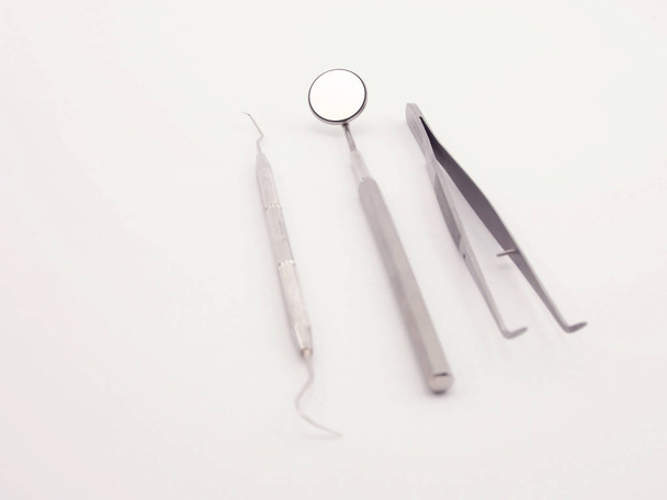 basic dental equipment on white background - Φωτογραφία, εικόνα