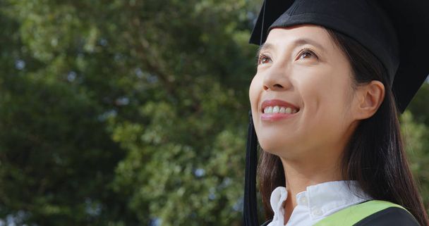 Woman get graduation think of future  - Photo, Image