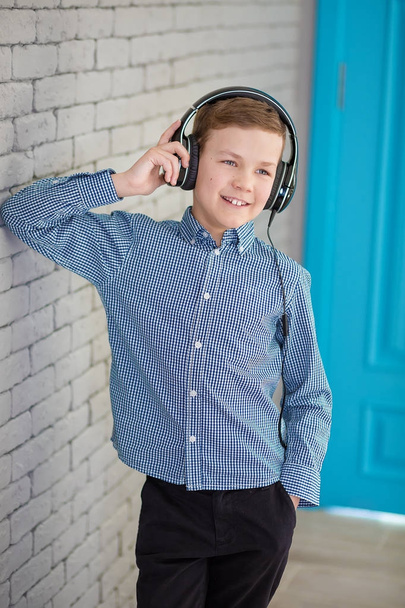 Relax and listening music concept. European boy fill the bit. Boy in casual wear. - Photo, image