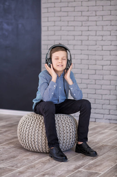 Relax and listening music concept. European boy fill the bit. Boy in casual wear. - Φωτογραφία, εικόνα