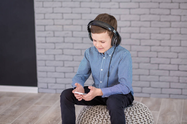 Relax and listening music concept. European boy fill the bit. Boy in casual wear. - Foto, Imagen
