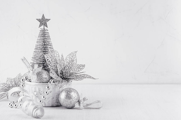 New year decorations of glitter silver on white plaster background. - Zdjęcie, obraz