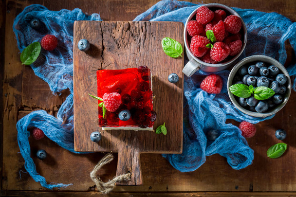 Tasty cake with fresh berries and jelly - Fotó, kép