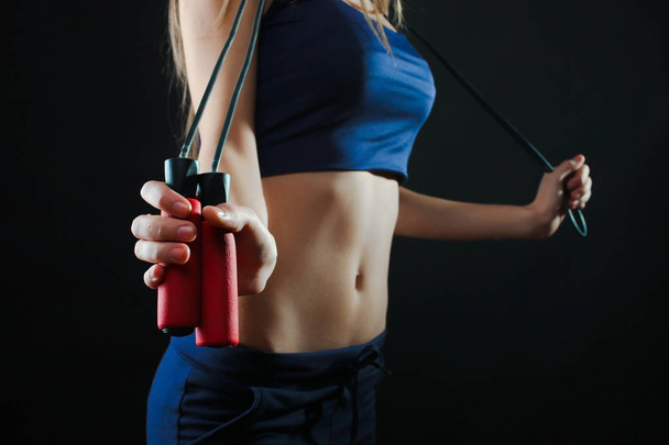Sportswoman with a skipping rope  - Photo, Image