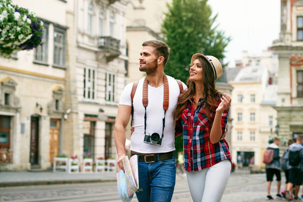 Beautiful Tourist Couple In Love Walking On Street Together. - 写真・画像
