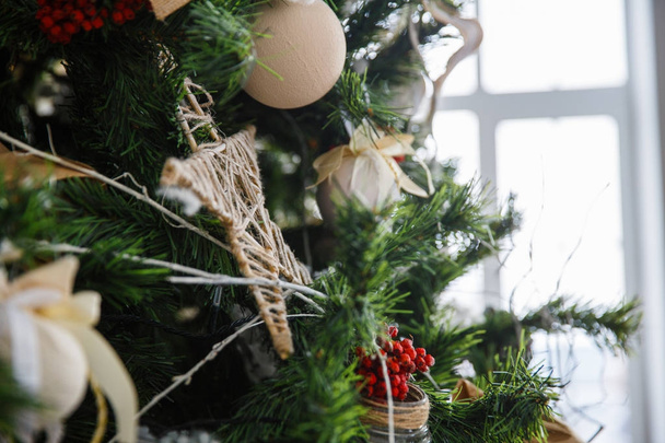 Christmas tree with toys and decorations in interior design - Valokuva, kuva