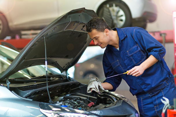 Car mechanic in workshop  - Photo, Image