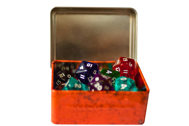 A lot Dices for board games in orange box, isolate on white - Photo, Image